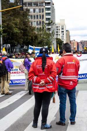 Photo for Bogota, Colombia - 18 October 2023. Coexistence managers at the peaceful protest of the members of the active reserve of the military and police forces in Bogota Colombia against the government of Gustavo Petro. - Royalty Free Image