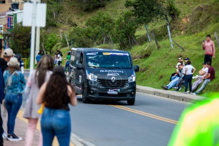 Photo for LA CALERA, COLOMBIA - FEBRUARY 11, 2024: Team accompanying vehicle. Sixth and final stage of the Tour Colombia cycling race as it passes through the municipality of La Calera in the department of Cundinamarca in Colombia - Royalty Free Image