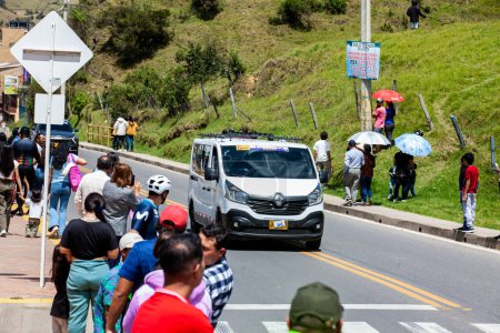 Photo for LA CALERA, COLOMBIA - FEBRUARY 11, 2024: Team accompanying vehicle. Sixth and final stage of the Tour Colombia cycling race as it passes through the municipality of La Calera in the department of Cundinamarca in Colombia - Royalty Free Image