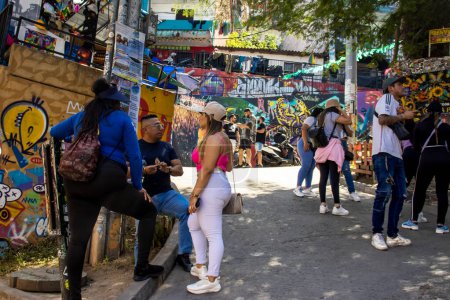 Photo for MEDELLIN, COLOMBIA - JANUARY 17, 2024:  Tourists at the famous Comuna 13 in Medellin on a beautiful sunny day - Royalty Free Image