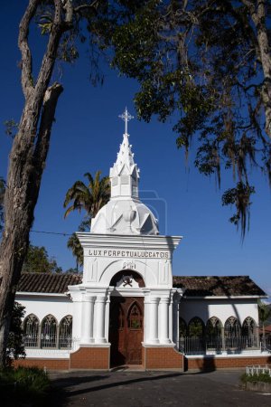 Facade of the historical Cemetery of Our Lady of La Valvanera built in 1903 at the beautiful heritage town of Salamina in the department of Caldas in Colombia. Text says May perpetual light shine upon them.