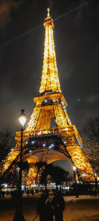 Photo for The eiffel tower of paris at sunset with beautiful lights of night - Royalty Free Image