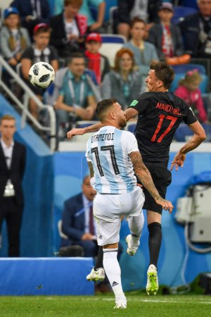 Photo for NIZHNIY NOVGOROD, RUSSIA - JUNE 21: Nicolas Otamendi of Argentina (L) and Mario Mandzukic of Croatia battle for possession during the 2018 FIFA World Cup Russia group D match between Argentina and Croatia - Royalty Free Image