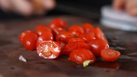 Photo for Cherry tomatoes cut into slices - Royalty Free Image