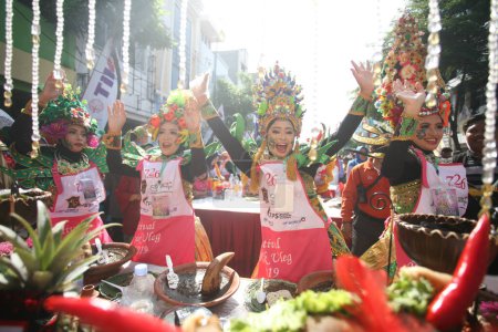 Photo for Surabaya residents participate in the celebration of the rujak ulek festival by wearing traditional clothes and costumes - Royalty Free Image