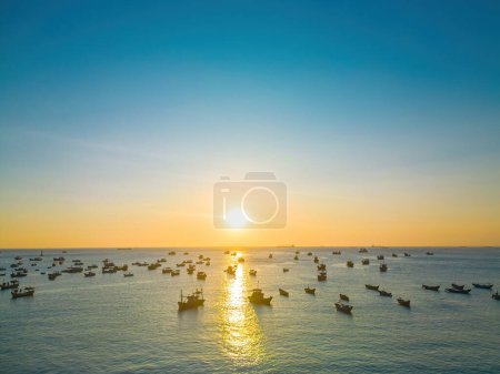 Photo for Beautiful cloudscape over the sea, sunrise shot. Lonely boats. Calm sea with sunset sky and sun through the clouds over. Calm sea with sunset sky or sunrise and sun through the clouds over. - Royalty Free Image