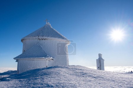 summit of Sniezka mountain in Giant mountains during winter in sunny day