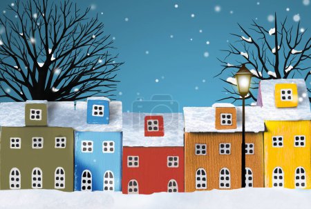 Foto de Coloridas casas en miniatura sobre fondo nevado de invierno de la ciudad. Banner de fondo de invierno urbano. Copiar espacio - Imagen libre de derechos