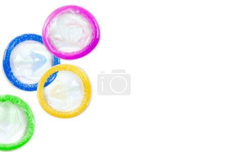 Photo for Condoms of various colors grouped on the left - Royalty Free Image