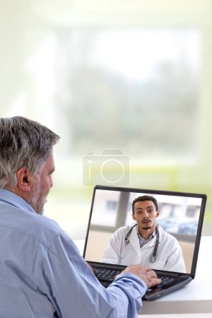 Photo for Man calls the doctor online. Future broadcast consultation. Diagnosis from home. Video-conference with therapist - Royalty Free Image
