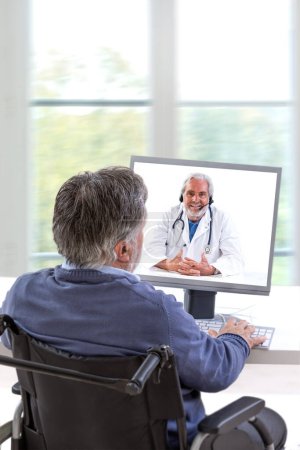 Photo for A man calls the doctor online. Telemedicine concept. Diagnosis from home. Video-conference with therapist - Royalty Free Image