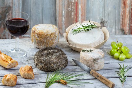 Photo for Corsican traditional varity of goat and sheep cheese on wood background - Royalty Free Image