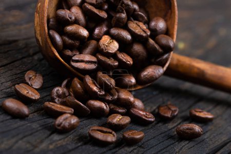 Photo for Coffee beans with wooden spoon , isolated - Royalty Free Image