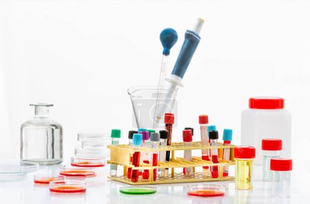 Photo for Research in laboratory analysis - Test tubes and Petri dishes with blood samples for analysis on table in laboratory urine sample - Royalty Free Image