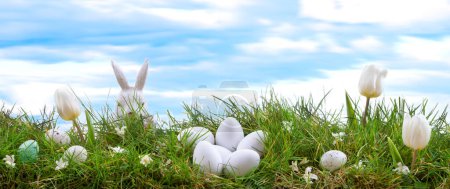 Photo for Easter scene with chicks and bunny in the spring meadow. - Royalty Free Image