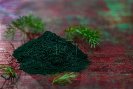Photo for Organic green spirulina powder top view wooden background. Super foods, food supplement - Royalty Free Image