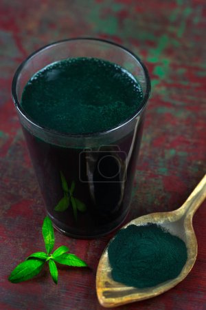 Photo for Organic green spirulina powder background. Super foods, food supplement source of vitamin protein and beta carotene. - Royalty Free Image