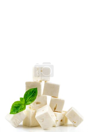 Photo for Cheese cubes isolated on white background with clipping path. Heap of Feta cheese, basil leaves and tomatoes. - Royalty Free Image