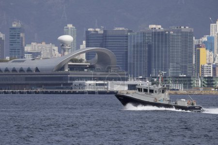 Photo for 2023 Jan 31,Hong Kong.Hong Kong Marine Police sailing in Victoria Harbor,background is Kai Tak Cruise Terminal. - Royalty Free Image