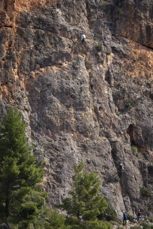 Photo for June 2021 - Albacete, Spain - Climbers climb a sheer cliff - Royalty Free Image