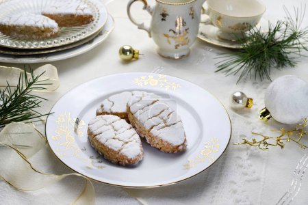 Photo for Ricciarelli pastries, typical Sienese Christmas sweet made with almond on white background. Christmas decorations. Traditional Italian desserts. Copy space. - Royalty Free Image
