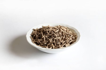 Bran sticks isolated on white background. Breakfast cereals rich in fibre. Healthy food. Copy space. Overhead view.