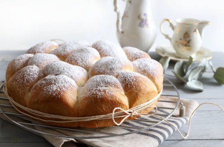 Homemade Austrian buns filled with  jam isolated on wooden gray background. Danube cake (Buchtlen). Sweet buns. Yeast dough cakes.