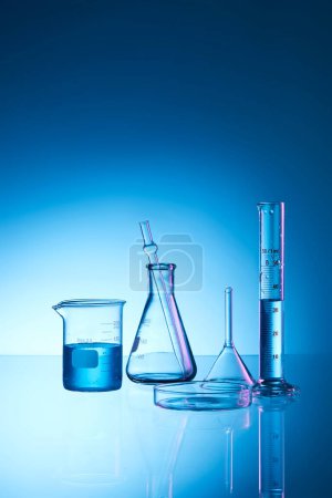 Photo for Laboratory flask with blue liquid - Royalty Free Image