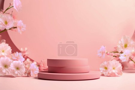 Téléchargez les photos : Podium rond avec branche de sakura de couleur rose. Mockup pour promouvoir des produits écologiques ou biologiques, cosmétiques. - en image libre de droit