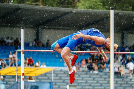 Photo for Chelyabinsk, Russia - June 23, 2022: unsuccessful attempt athlete high jump in rain - Royalty Free Image