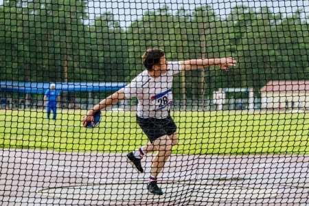 Photo for Athlete thrower attempt in discus throwing - Royalty Free Image