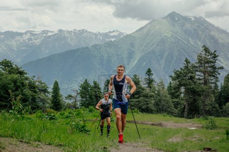 Photo for Arkhyz, Russia - July 1, 2022: two male runner running uphill trail in Arkhyz X Run - Royalty Free Image