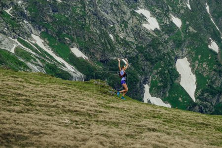 Photo for Arkhyz, Russia - July 2, 2022: female runner run trail down mountain in Arkhyz X Run - Royalty Free Image