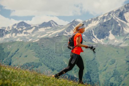 Photo for Arkhyz, Russia - July 3, 2022: female runner run trail down mountain in Arkhyz X Run - Royalty Free Image