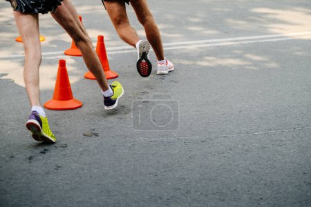Photo for Legs two male athletes racewalking in athletics competition - Royalty Free Image