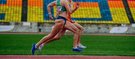 Photo for Sochi, Russia - October 5, 2022: blind female runner with guide run sprint race - Royalty Free Image