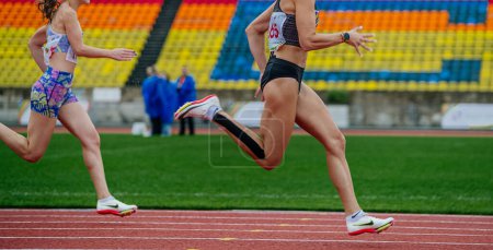 Photo for Sochi, Russia - October 5, 2022: female athletes run in Nike spikes shoes - Royalty Free Image