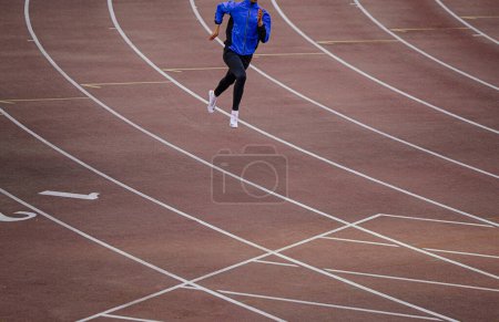 Photo for Chelyabinsk, Russia - June 4, 2022: male athlete running training in UFD Athletics Championship - Royalty Free Image
