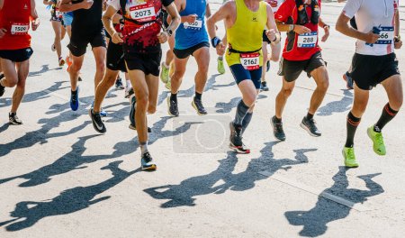 Photo for Group male runners athletes running marathon, running apparel Nike, Adidas, Asics, Puma, sports editorial photos - Royalty Free Image