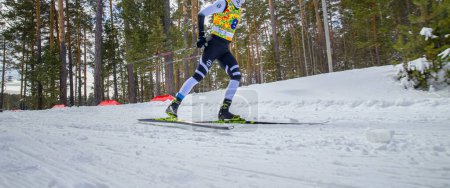 Photo for Male athlete running in cross-country skiing, Fischer racing skis, winter olympic sports, editorial photo - Royalty Free Image