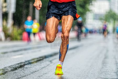 Photo for Close-up muscular legs male runner running marathon city race, athlete run on wet asphalt after rain - Royalty Free Image