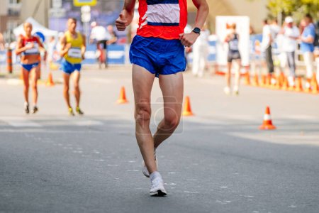 Photo for Male racewalker walking distance in athletics competition, summer athletics championships - Royalty Free Image