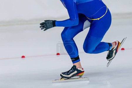Photo for Close-up male skaters run srint race in speed skating competition, winter sports games - Royalty Free Image