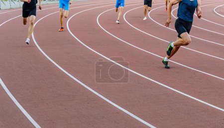 Photo for Runner leader run ahead of sprint race on turn stadium track, summer athletics championship - Royalty Free Image