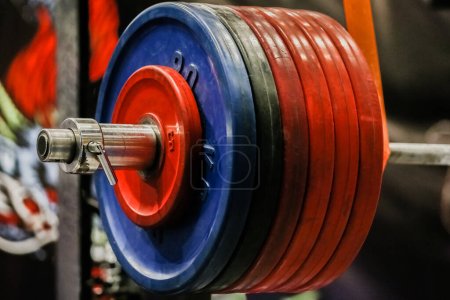 Photo for Close-up heavy barbell lying on racks monolift, squat powerlifting competition - Royalty Free Image