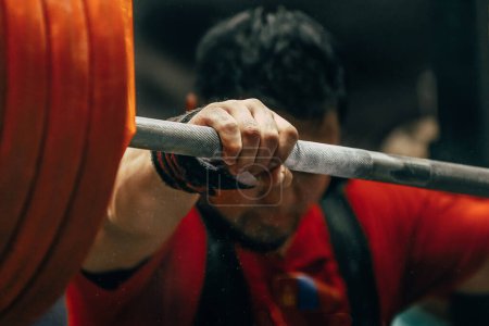 Photo for Hand male powerlifter hold heavy barbell before squatting powerlifting competition, focus on foreground - Royalty Free Image