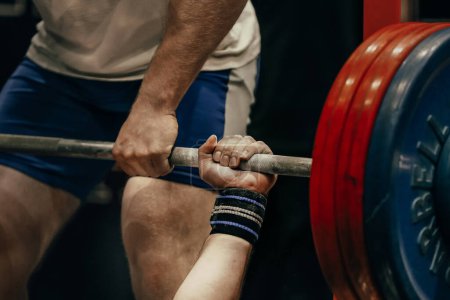 Photo for Hand male powerlifter hold barbell bar before bench press powerlifting competition, power sports games - Royalty Free Image