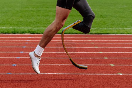 Photo for Legs runner para-athlete on prosthesis running red track stadium, summer para athletics championships - Royalty Free Image