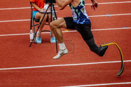 Photo for Male para jumper on limb deficiency run up long jump, summer para athletics championships, Nike brand running spikes shoes - Royalty Free Image