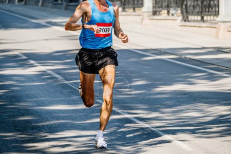 Photo for Male leader runner athlete running marathon race, sports summer games - Royalty Free Image